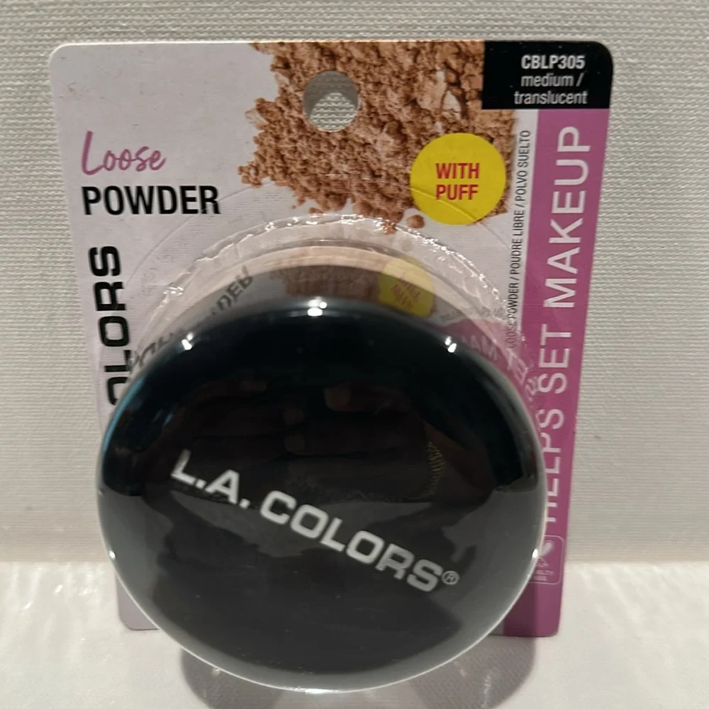 L.A. Colors Loose Medium Translucent Powder with Puff. Helps set Makeup.